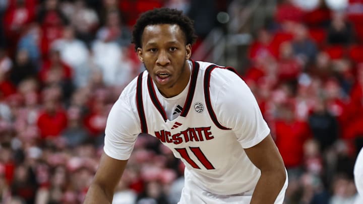 Feb 7, 2026; Raleigh, North Carolina, USA; NC State Wolfpack guard Quadir Copeland (11) dribbles the ball during the first half of the game against the Virginia Tech Hokies at Lenovo Center. Mandatory Credit: Jaylynn Nash-Imagn Images