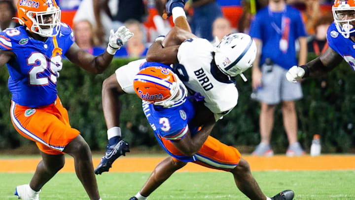 Florida Gators defensive back Jason Marshall Jr. (3) tackles Samford Bulldogs wide receiver Preston Bird (84) during the second half at Ben Hill Griffin Stadium in Gainesville, FL on Saturday, September 7, 2024 against the Samford Bulldogs. The Florida Gators won 45-7 over the Bulldogs. [Doug Engle/Gainesville Sun]