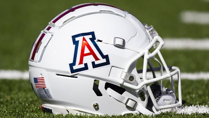 Nov 25, 2022; Tucson, Arizona, USA; Detailed view of an Arizona Wildcats helmet on the field during the Territorial Cup at Arizona Stadium. Mandatory Credit: Mark J. Rebilas-Imagn Images Nov 25, 2022; Tucson, Arizona, USA; Detailed view of an Arizona Wildcats helmet on the field during the Territorial Cup at Arizona Stadium. Mandatory Credit: Mark J. Rebilas-Imagn Images