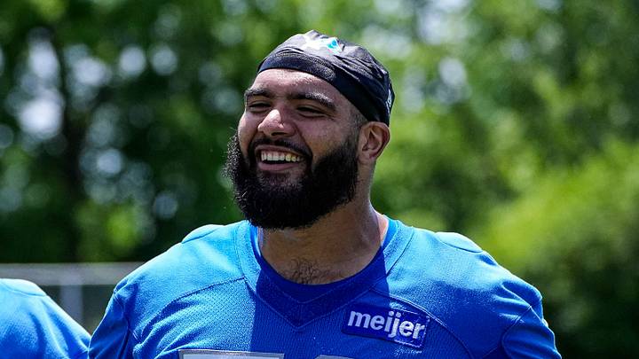 Detroit Lions offensive lineman Juice Scruggs (70), right, and offensive lineman Melvin Priestly (74) walk off the field after practice during OTAs at Meijer Performance Center in Allen Park on Thursday, June 11, 2026.