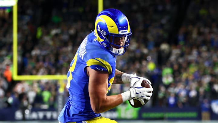 Dec 18, 2025; Seattle, Washington, USA; Los Angeles Rams tight end Terrance Ferguson (18) runs to score a touchdown against Seattle Seahawks safety Nick Emmanwori (3) in the first half at Lumen Field. Mandatory Credit: Kevin Ng-Imagn Images
