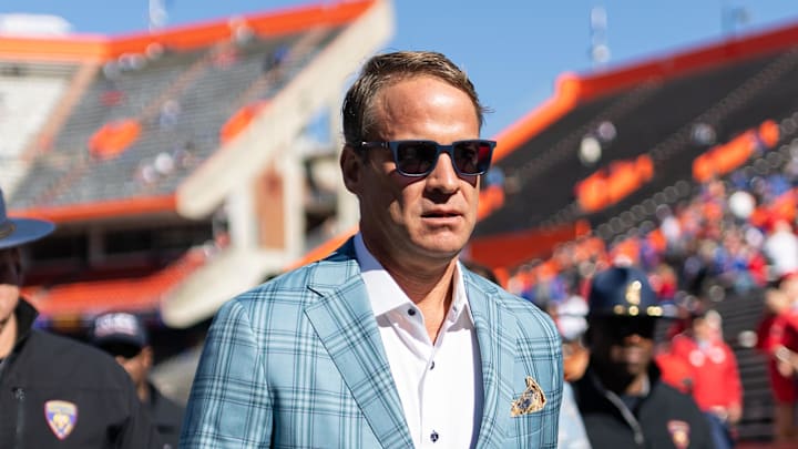 Nov 23, 2024; Gainesville, Florida, USA; Mississippi Rebels head coach Lane Kiffin walks off the field before a game against the Florida Gators at Ben Hill Griffin Stadium.