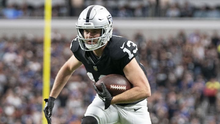 November 5, 2023; Paradise, Nevada, USA; Las Vegas Raiders wide receiver Hunter Renfrow (13) runs the football against New York Giants safety Xavier McKinney (29) during the second quarter at Allegiant Stadium. Mandatory Credit: Kyle Terada-Imagn Images