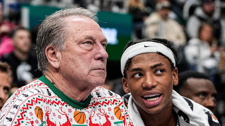 Michigan State head coach Tom Izzo talks to guard Jeremy Fears Jr. (1) from the bench during the second half against Oakland at Little Caesars Arena in Detroit on Saturday, Dec. 20, 2025.