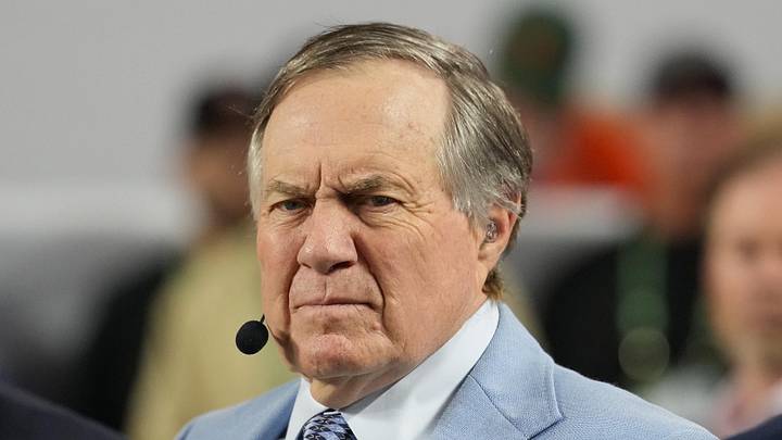 Jan 19, 2026; Miami Gardens, FL, USA; TV analyst Bill Belichick watches the Miami Hurricanes play the Indiana Hoosiers during the first half of the College Football Playoff National Championship game at Hard Rock Stadium. Mandatory Credit: Kirby Lee-Imagn Images