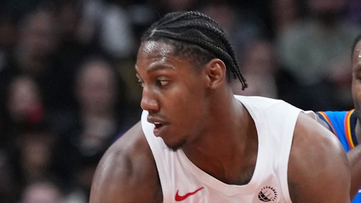 Toronto Raptors forward RJ Barrett dribbles against Oklahoma City Thunder guard Cason Wallace.