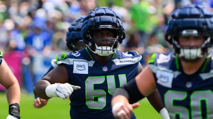 Jul 27, 2024; Renton, WA, USA; Seattle Seahawks guard Christian Haynes (64) during training camp at Virginia Mason Athletic Center.