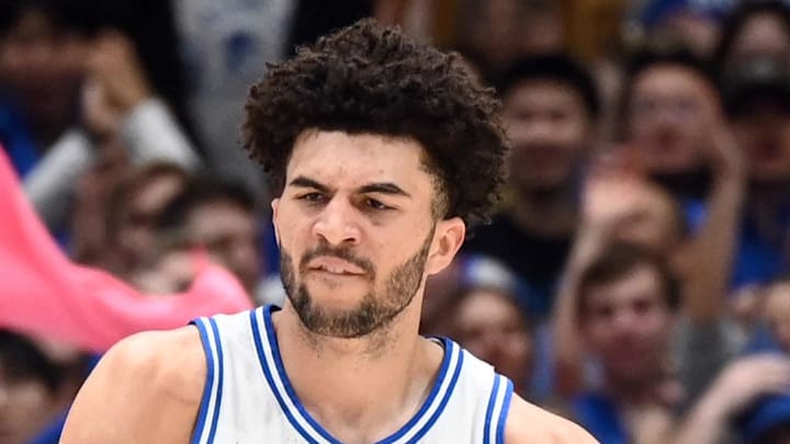 Feb 14, 2026; Durham, North Carolina, USA; Duke Blue Devils forward Cameron Boozer (12) is greeted by forward Dame Sarr (7) after scoring a basket during the first half against the Clemson Tigers at Cameron Indoor Stadium. Mandatory Credit: Rob Kinnan-Imagn Images