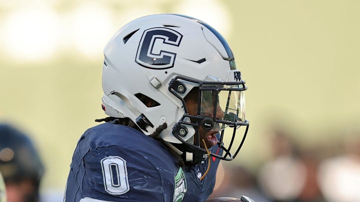 Dec 27, 2025; Boston, MA, USA; UConn Huskies running back Cam Edwards (0) runs the ball against the Army Black Knights during the first half of the Wasabi Fenway Bowl at Fenway Park. Dec 27, 2025; Boston, MA, USA; UConn Huskies running back Cam Edwards (0) runs the ball against the Army Black Knights during the first half of the Wasabi Fenway Bowl at Fenway Park.