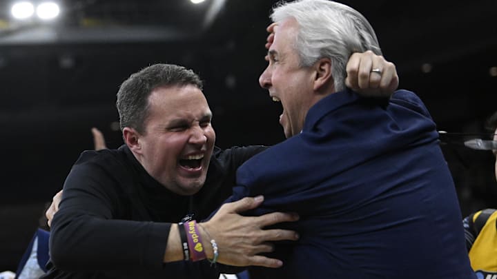 Mar 20, 2025; Providence, RI, USA; McNeese State Cowboys head coach Will Wade (middle) celebrates with McNeese University president Wade Rousse (right) after defeating the Clemson Tigers at Amica Mutual Pavilion. Mandatory Credit: Eric Canha-Imagn Images Mar 20, 2025; Providence, RI, USA; McNeese State Cowboys head coach Will Wade (middle) celebrates with McNeese University president Wade Rousse (right) after defeating the Clemson Tigers at Amica Mutual Pavilion. Mandatory Credit: Eric Canha-Imagn Images