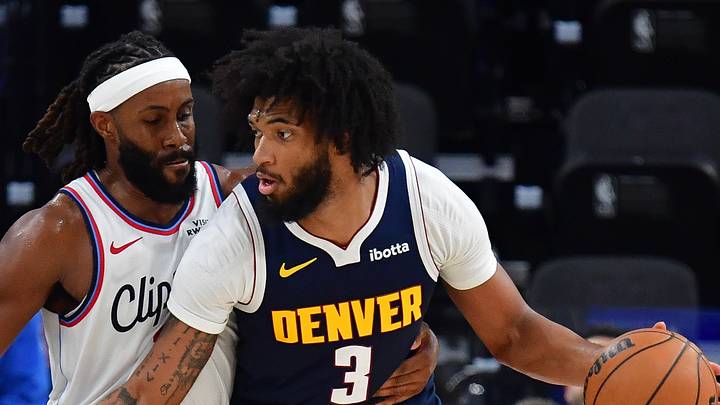 Oct 14, 2026; Inglewood, California, USA; Denver Nuggets center Marvin Bagley III (3) moves the ball against Los Angeles Clippers center Isaiah Jackson (23) during the second half at Intuit Dome. Mandatory Credit: Gary A. Vasquez-Imagn Images