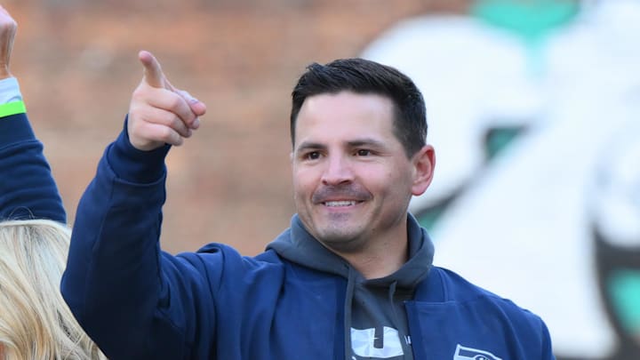 Seattle Seahawks head coach Mike Macdonald interacts with fans