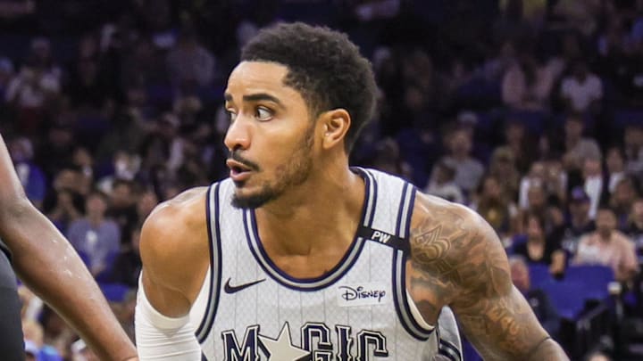 Dec 29, 2024; Orlando, Florida, USA; Orlando Magic guard Gary Harris (14) drives past Brooklyn Nets center Day'Ron Sharpe (20) during the second half at Kia Center. Mandatory Credit: Mike Watters-Imagn Images