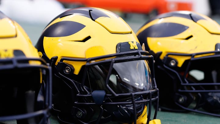 Dec 31, 2024; Tampa, FL, USA; Michigan Wolverines helmets sit on the field before a game against the Alabama Crimson Tide at Raymond James Stadium. Mandatory Credit: Matt Pendleton-Imagn Images