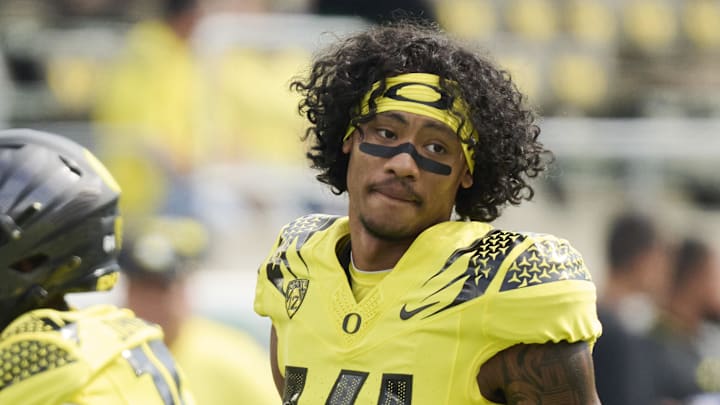 Sep 2, 2023; Eugene, Oregon, USA; Oregon Ducks wide receiver Justius Lowe (14) takes a break during warm-ups before a game against the Portland State Vikings at Autzen Stadium. 