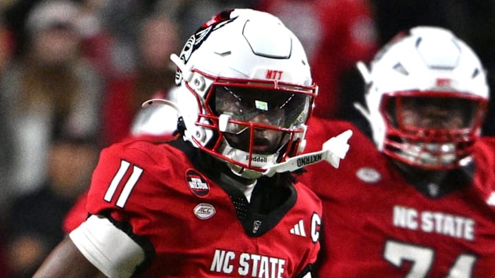Nov 1, 2025; Raleigh, North Carolina, USA;  North Carolina State Wolfpack quarterback CJ Bailey (11) runs the ball during the first quarter against the Georgia Tech Yellow Jackets at Carter-Finley Stadium. Mandatory Credit: Zachary Taft-Imagn Images