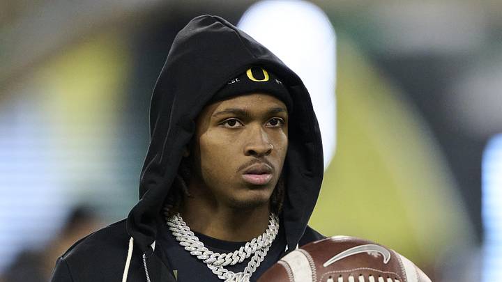 Nov 14, 2025; Eugene, Oregon, USA; Oregon Ducks wide receiver Dakorien Moore (1) watches teammates warm up before a game against the Minnesota Golden Gophers at Autzen Stadium. Mandatory Credit: Troy Wayrynen-Imagn Images Nov 14, 2025; Eugene, Oregon, USA; Oregon Ducks wide receiver Dakorien Moore (1) watches teammates warm up before a game against the Minnesota Golden Gophers at Autzen Stadium. Mandatory Credit: Troy Wayrynen-Imagn Images