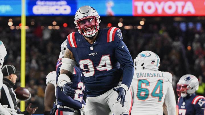 Jan 4, 2026; Foxborough, Massachusetts, USA; New England Patriots defensive tackle Cory Durden (94) reacts to a defensive stop against the Miami Dolphins during the first half at Gillette Stadium. Mandatory Credit: Brian Fluharty-Imagn Images