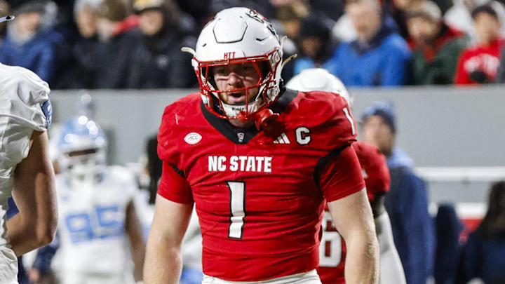 Nov 29, 2025; Raleigh, North Carolina, USA;  NC State Wolfpack linebacker Caden Fordham (1) celebrates a down during the first half of the game against North Carolina Tar Heels at Carter-Finley Stadium.  Mandatory Credit: Jaylynn Nash-Imagn Images