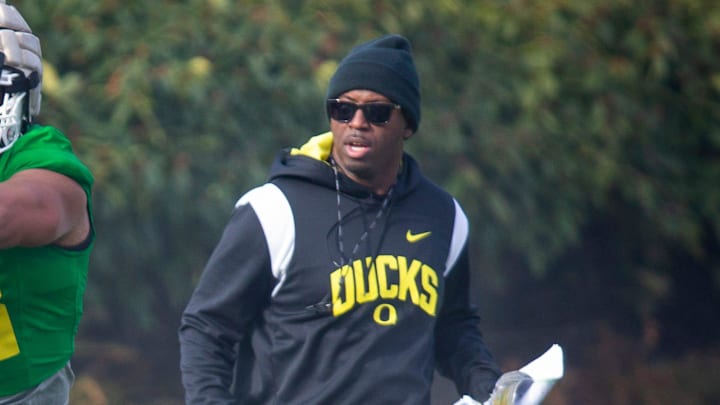 New co-defensive coordinator and safeties coach Chris Hampton, right, joins the first practice of spring for Oregon football as they prepare for the 2023 season.