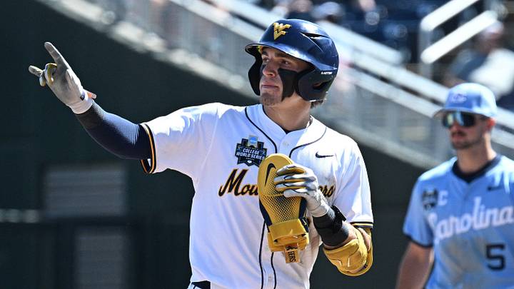 Jun 17, 2026; Omaha, NE, USA;  West Virginia Mountaineers second baseman Gavin Kelly (2) signals after hitting a home run against the West Virginia Mountaineers during the eighth inning at Charles Schwab Field. Mandatory Credit: Steven Branscombe-Imagn Images