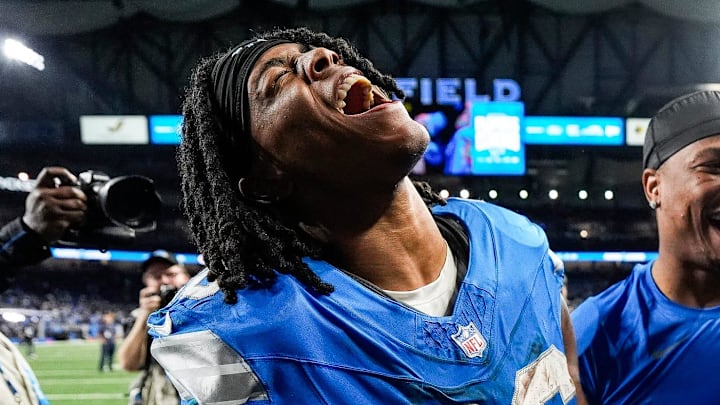 Detroit Lions running back Jahmyr Gibbs (26) and running back David Montgomery (5) celebrate 34-31 win over Green Bay Packers as he exits the field at Ford Field in Detroit on Thursday, Dec. 5, 2024.