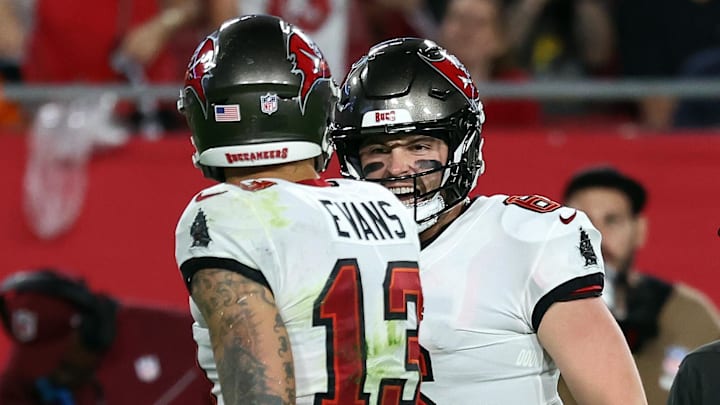 Dec 3, 2023; Tampa, Florida, USA;Tampa Bay Buccaneers quarterback Baker Mayfield (6) celebrates with wide receiver Mike Evans (13) after he scored a touchdown  against the Carolina Panthers  during the second half at Raymond James Stadium. Mandatory Credit: Kim Klement Neitzel-Imagn Images