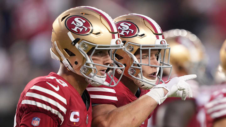 San Francisco 49ers running back Christian McCaffrey (R) and quarterback Brock Purdy (L)