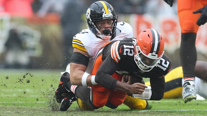 Dec 28, 2025; Cleveland, Ohio, USA; Cleveland Browns quarterback Shedeur Sanders (12) is sacked by Pittsburgh Steelers linebacker Alex Highsmith (56) in the second quarter at Huntington Bank Field. Mandatory Credit: Scott Galvin-Imagn Images