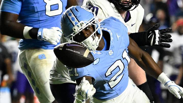 Sep 1, 2025; Chapel Hill, North Carolina, USA; North Carolina Tar Heels defensive back Kaleb Cost (21) intercepts a pass in the second quarter at Kenan Stadium. Mandatory Credit: Bob Donnan-Imagn Images Sep 1, 2025; Chapel Hill, North Carolina, USA; North Carolina Tar Heels defensive back Kaleb Cost (21) intercepts a pass in the second quarter at Kenan Stadium. Mandatory Credit: Bob Donnan-Imagn Images