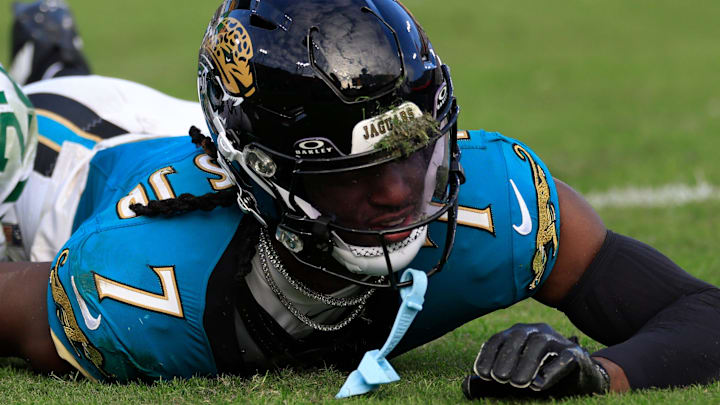 Jacksonville Jaguars wide receiver Brian Thomas Jr. (7) comes up with a face full of turf against New York Jets safety Tony Adams (22) during the third quarter Sunday, Dec. 15, 2024 at EverBank Stadium in Jacksonville, Fla. The Jets held off the Jaguars 32-25. [Corey Perrine/Florida Times-Union]