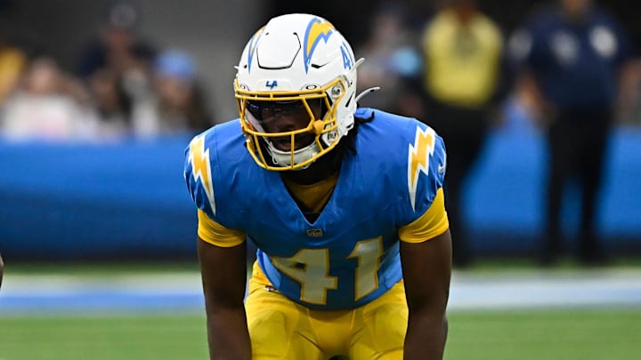 Nov 10, 2024; Inglewood, California, USA; Los Angeles Chargers cornerback Eli Apple (41) and Tennessee Titans cornerback Justin Hardee Sr. (26) during the fourth quarter at SoFi Stadium. Mandatory Credit: Robert Hanashiro-Imagn Images