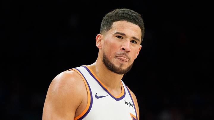 Phoenix Suns guard Devin Booker (1) reacts and sticks out his tung after a foul is called against the Suns during the second half of a game against the Atlanta Hawks at Mortgage Matchup Center. Mandatory Credit: Allan Henry-Imagn Images