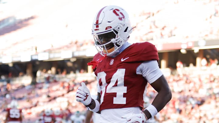 Stanford Cardinal wide receiver Ismael Cisse (84) scores a touchdown against the Cal Poly Mustangs during the second half at Stanford Stadium.