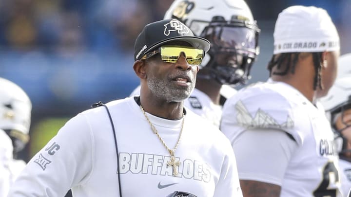 Nov 8, 2025; Morgantown, West Virginia, USA; Colorado Buffaloes head coach Deion Sanders watches the big screen during a replay during the first quarter against the West Virginia Mountaineers at Milan Puskar Stadium.