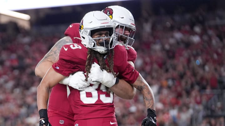 Arizona Cardinals Xavier Weaver (89) celebrates his touchdown with teammate Jake Curhan (64) against the Kansas City Chiefs during their preseason game at State Farm Stadium on Aug. 9, 2025. Arizona Cardinals Xavier Weaver (89) celebrates his touchdown with teammate Jake Curhan (64) against the Kansas City Chiefs during their preseason game at State Farm Stadium on Aug. 9, 2025.