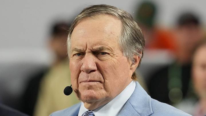 Jan 19, 2026; Miami Gardens, FL, USA; TV analyst Bill Belichick watches the Miami Hurricanes play the Indiana Hoosiers during the first half of the College Football Playoff National Championship game at Hard Rock Stadium. Mandatory Credit: Kirby Lee-Imagn Images