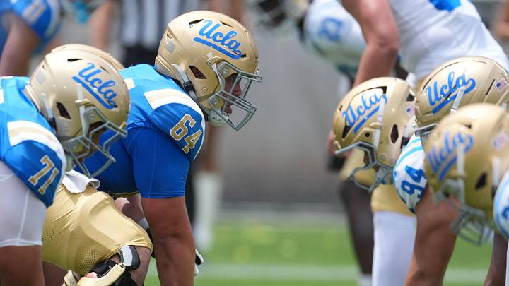 May 2, 2026; Pasadena, CA, USA; A general overall view of helmets at the line of scrimmage as UCLA Bruins center Sam Yoon (64) snaps the ball during the spring game at Rose Bowl. Mandatory Credit: Kirby Lee-Imagn Images