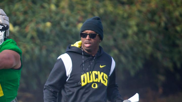 New co-defensive coordinator and safeties coach Chris Hampton, right, joins the first practice of spring for Oregon football as they prepare for the 2023 season.