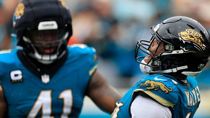 Jacksonville Jaguars defensive end Travon Walker (44) reacts to forcing a fumble with defensive end Josh Hines-Allen (41) during the second quarter of an NFL football matchup Sunday, Oct. 6, 2024 at EverBank Stadium in Jacksonville, Fla. 
