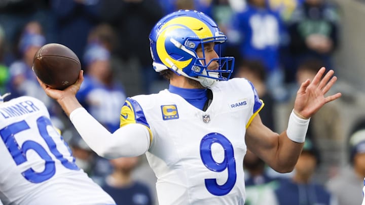 Nov 3, 2024; Seattle, Washington, USA; Los Angeles Rams quarterback Matthew Stafford (9) passes against the Seattle Seahawks during the first quarter at Lumen Field. Mandatory Credit: Joe Nicholson-Imagn Images