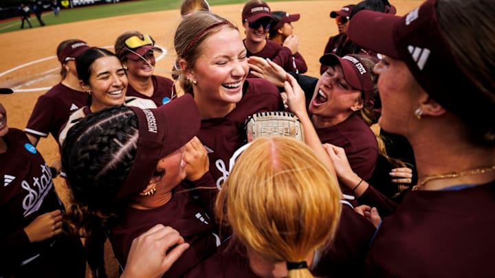 Mississippi State celebrates with Alyssa Faircloth after her no-hitter in a NCAA Regional game against Oregon.