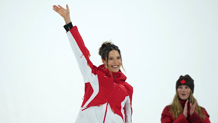 Feb 16, 2026; Livigno, Italy; Silver medalist Ailing Eileen Gu of the People's Republic of China celebrates during the medal ceremony for the women's big air final during the Milano Cortina 2026 Olympic Winter Games at Livigno Snow Park. Mandatory Credit: Joe Camporeale-Imagn Images