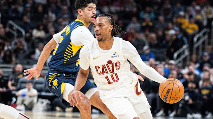 Jan 14, 2025; Indianapolis, Indiana, USA;  Cleveland Cavaliers guard Darius Garland (10) dribbles the ball while  Indiana Pacers guard Ben Sheppard (26) defends in the first half at Gainbridge Fieldhouse. Mandatory Credit: Trevor Ruszkowski-Imagn Images