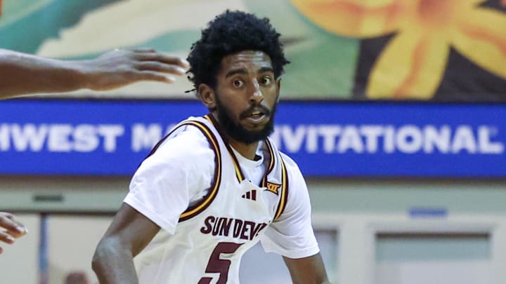 Nov 26, 2025; Lahaina, HI, USA; Arizona State Sun Devils guard Moe Odum (5) tries to get around the USC Trojans defense during the first half of the championship match at Lahaina Civic Center. Mandatory Credit: Marco Garcia-Imagn Images