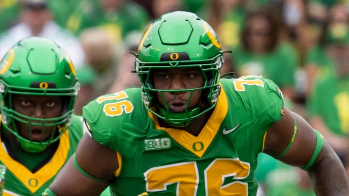 Oregon offensive lineman Isaiah World clears a path as the Oregon Ducks host the Oklahoma State Cowboys on Sept. 6, 2025, at Autzen Stadium in Eugene, Oregon.