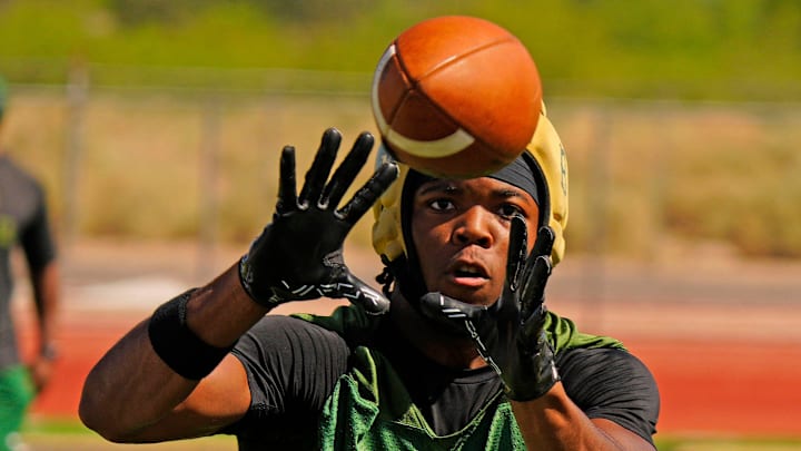 Basha running back Noah Roberts (6) catches a pass during a spring showcase for college coaches at Basha High School on May 14, 2025 in Chandler, Ariz.