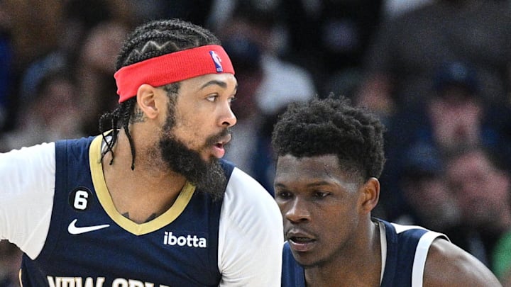 New Orleans Pelicans forward Brandon Ingram controls the ball as Minnesota Timberwolves guard Anthony Edwards defends.