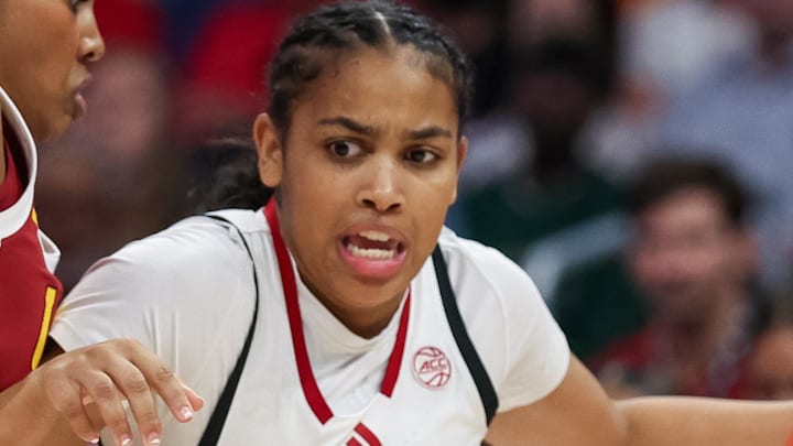 Nov 9, 2025; Charlotte, North Carolina, USA; NC State Wolfpack guard Zamareya Jones (3) drives to the basket against the Southern California Trojans during the first quarter of the Ally Tipoff game at Spectrum Center. Mandatory Credit: Cory Knowlton-Imagn Images