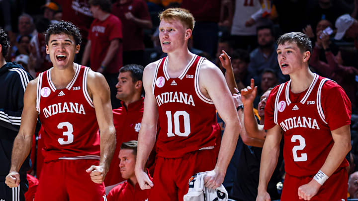 Indiana's Anthony Leal (3), Luke Goode (10) and Gabe Cupps (2) celebrate during the exhibition game at Tennessee.